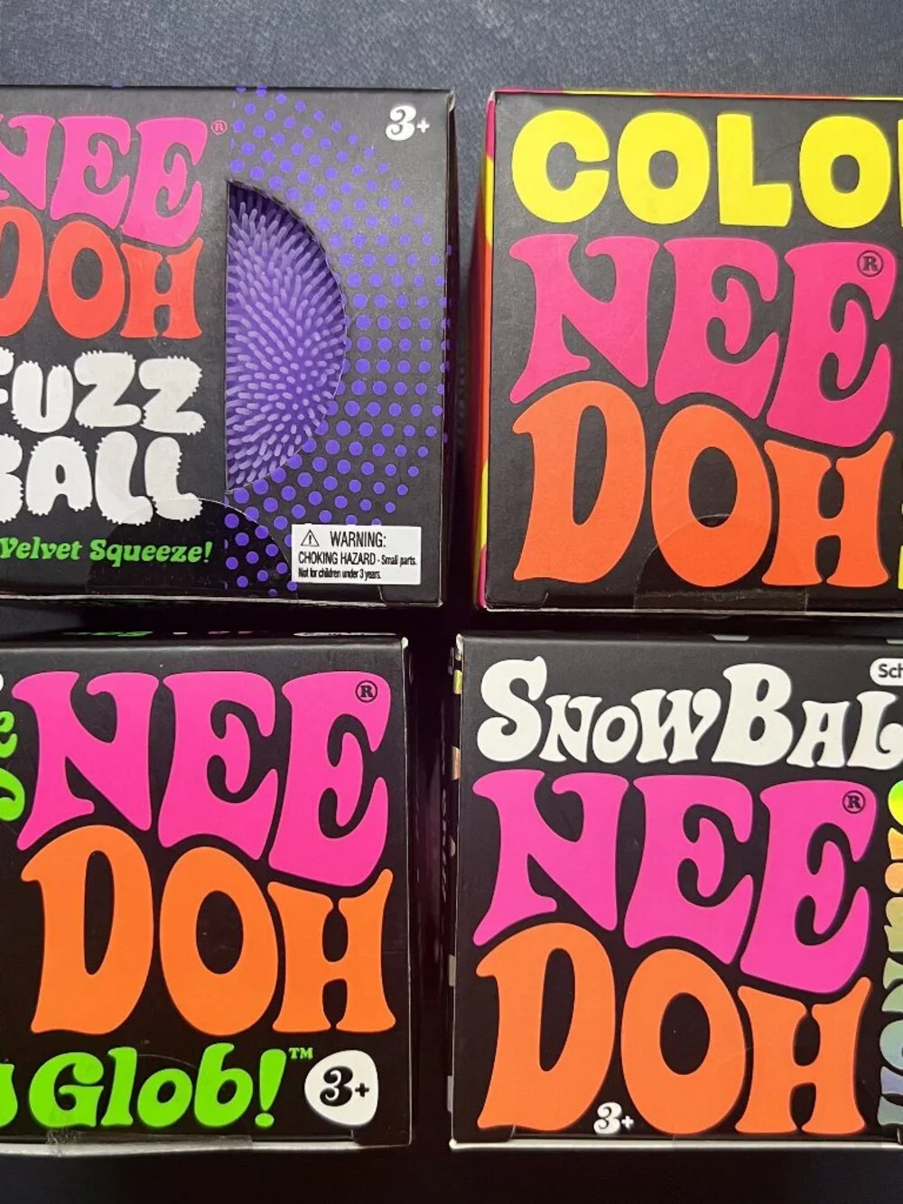 4 Nee Doh playdough packs Fuzz Ball & The Groovy Glob & Color Change & Snow Ball